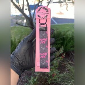 02: bad bunny keychain with plane black on the inside.